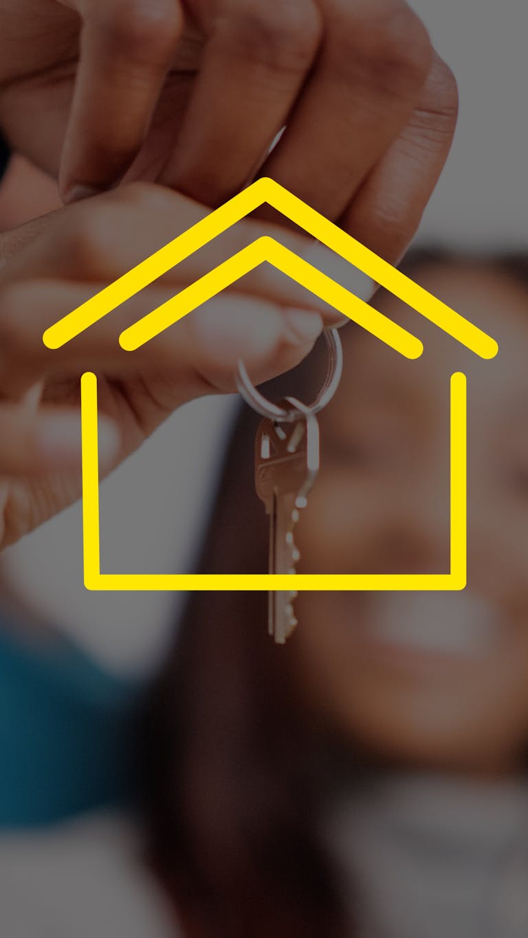 First time home buyers holding house keys representing real estate.